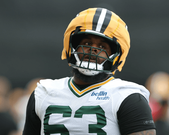 Beloved Packers LT Joins Panthers After Failed Contract Negotiations - Sends Farewell to Green Bay Fans After 4 Years of Commitment